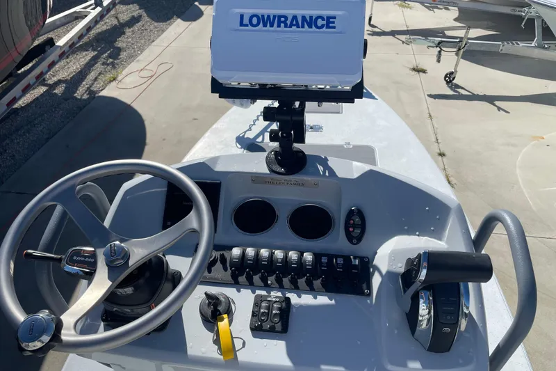 Slide: The Image of 2021 Young Boats Gulfshore 22 deck, featuring storage compartments and fishing rod holders. - 5