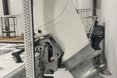 Slide: The Image of 2021 Young Boats Gulfshore 22 with Minn Kota trolling motor on deck. - 8