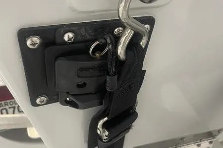 Slide: The Image of 2021 Young Boats Gulfshore 22 console with steering wheel and controls. - 9