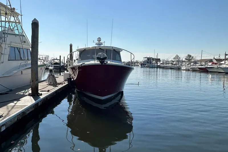 Slide: The Image of 2017 Back Cove 41 docked at a marina under clear blue skies. - 11