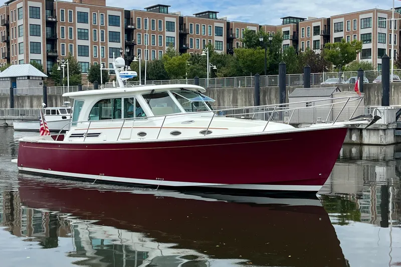 Slide: The Image of 2017 Back Cove 41 boat docked in urban marina setting. - 121