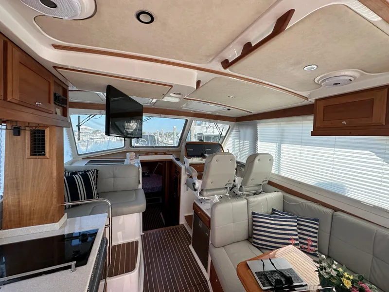 Slide: The Image of Interior of a 2017 Back Cove 41 yacht, featuring elegant seating and modern amenities. - 27
