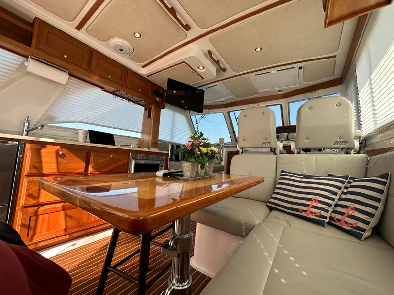 Slide: The Image of Luxurious interior of a 2017 Back Cove 41 yacht with elegant seating and wooden finishes. - 34