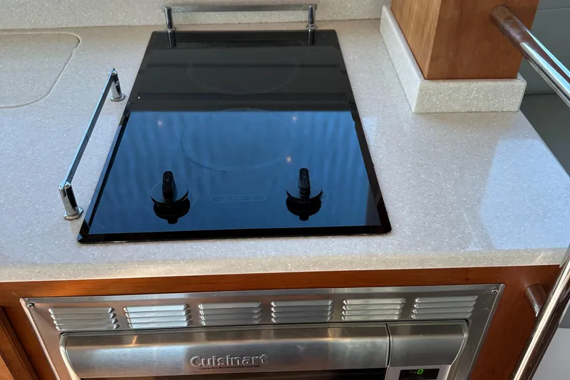Slide: The Image of Stovetop and oven in 2017 Back Cove 41 yacht kitchen. - 36