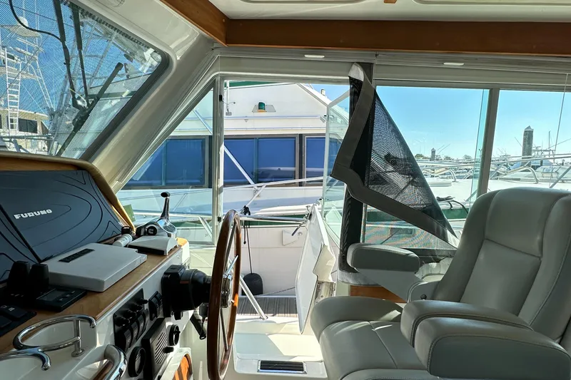 Slide: The Image of Interior view of 2017 Back Cove 41 yacht cockpit with steering wheel and seating. - 47