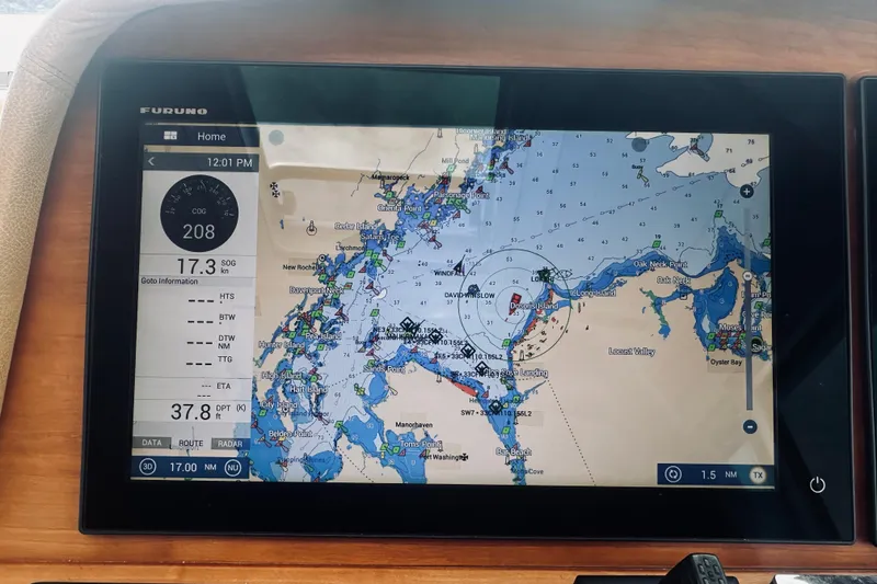 Slide: The Image of Navigation display on 2017 Back Cove 41, showing detailed marine chart and speed data. - 54