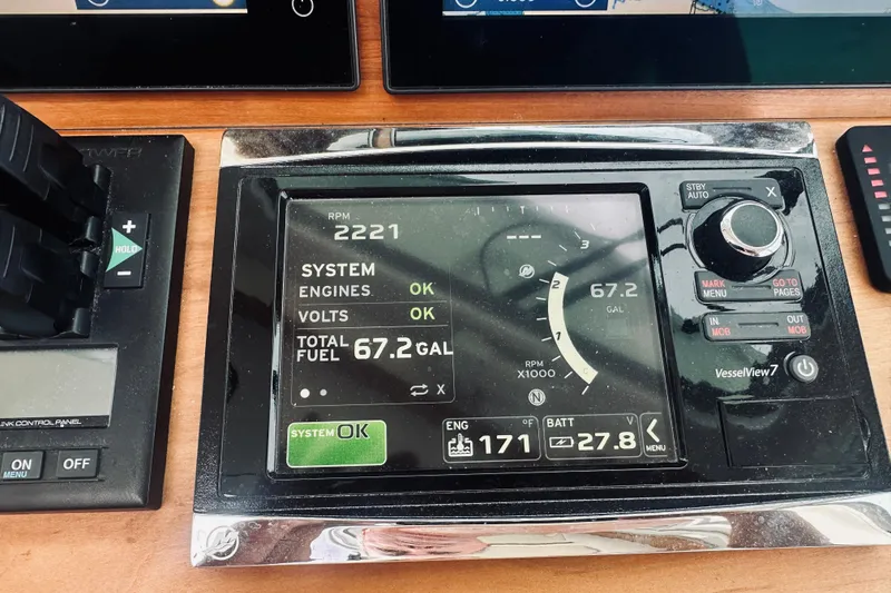 Slide: The Image of Control panel display on a 2017 Back Cove 41 boat showing engine and fuel data. - 56