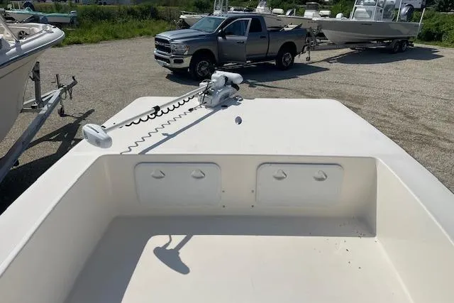 Slide: The Image of 2007 KenCraft 2260 BAYRIDER boat with trolling motor, parked near a pickup truck. - 10