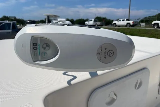 Slide: The Image of Trolling motor control on 2007 KenCraft 2260 BAYRIDER boat, sunny day, parked vehicles in background. - 15