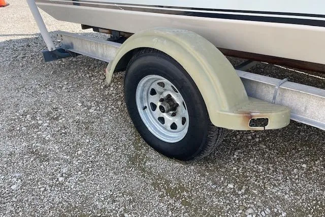 Slide: The Image of Trailer wheel of 2007 KenCraft 2260 BAYRIDER on gravel surface. - 19