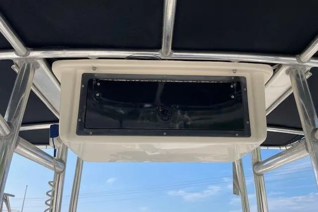 Slide: The Image of 2007 KenCraft 2260 BAYRIDER T-top storage compartment with clear sky background. - 5