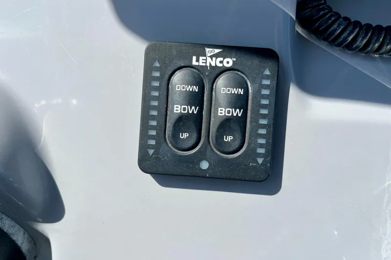 Slide: The Image of Lenco trim tab control panel on 2023 Trophy T24CC boat dashboard. - 12