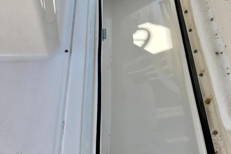 Slide: The Image of Close-up of 2023 Trophy T24CC boat deck with white textured surface. - 18