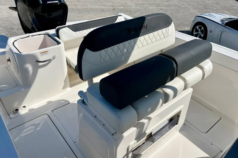 Slide: The Image of 2023 Trophy T24CC boat interior with seating and storage compartments. - 9