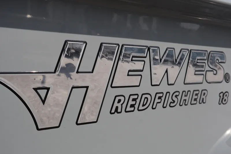 Slide: The Image of 2025 Hewes Redfisher 18 logo on boat exterior. - 10
