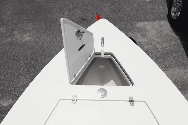 Slide: The Image of 2025 Hewes Redfisher 18 boat with open storage compartment on deck. - 7