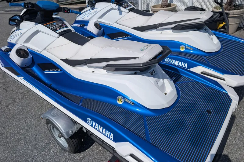 Slide: The Image of 2021 Yamaha WaveRunner VX Deluxe jet skis on a trailer, blue and white design. - 10