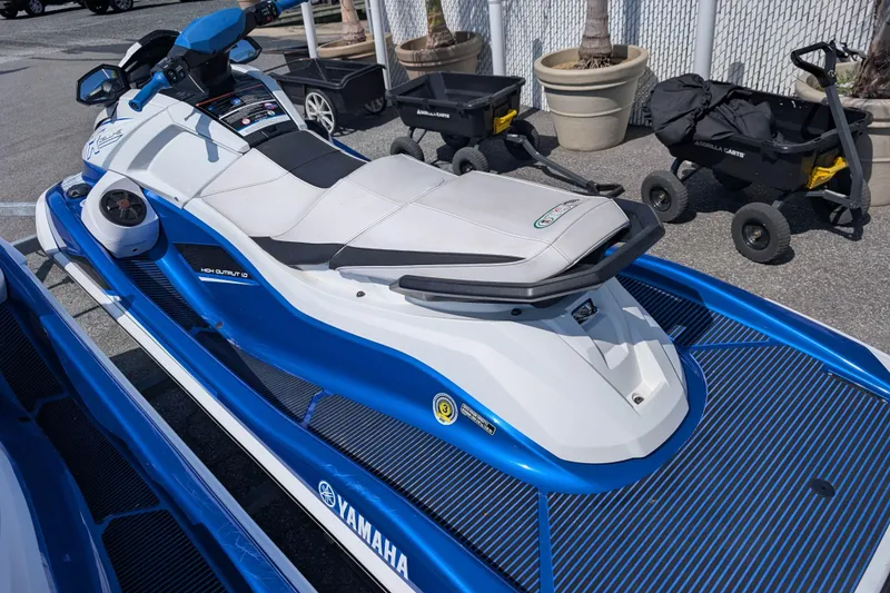 Slide: The Image of 2021 Yamaha WaveRunner VX Deluxe in blue and white, parked outdoors. - 11