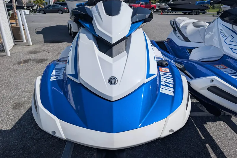 Slide: The Image of 2021 Yamaha WaveRunner VX Deluxe in blue and white, parked outdoors. - 4