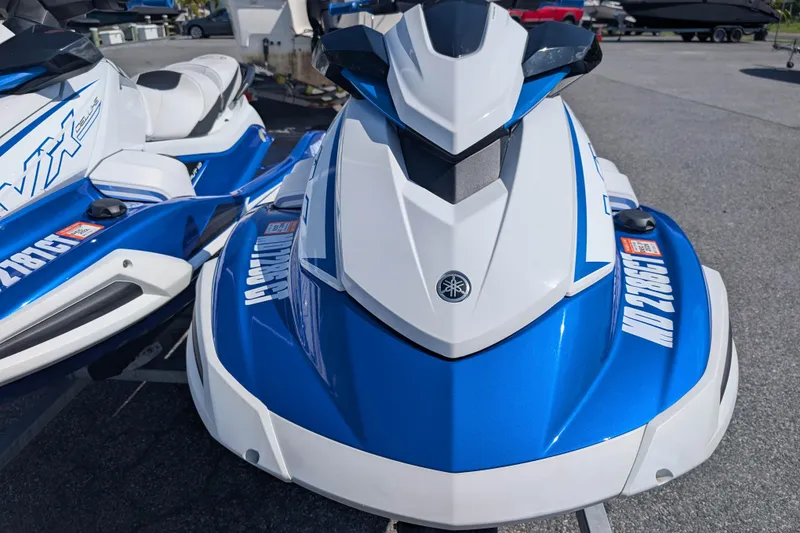Slide: The Image of 2021 Yamaha WaveRunner VX Deluxe in blue and white, parked outdoors. - 5