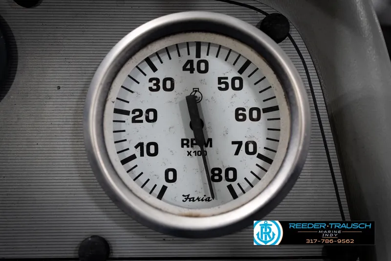 Slide: The Image of Close-up of a Faria RPM gauge on a 1993 Godfrey Sweetwater boat dashboard. - 35