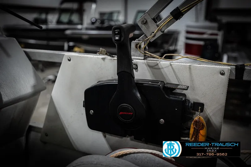 Slide: The Image of Control panel of a 1993 Godfrey Sweetwater boat with Mercury throttle. - 36