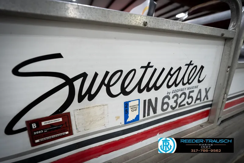 Slide: The Image of 1993 Godfrey Sweetwater boat with registration IN 6325 AX, Reeder-Trausch Marine logo visible. - 44