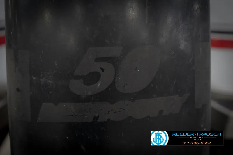 Slide: The Image of Close-up of a 1993 Godfrey Sweetwater boat engine with faded "50" marking. - 46