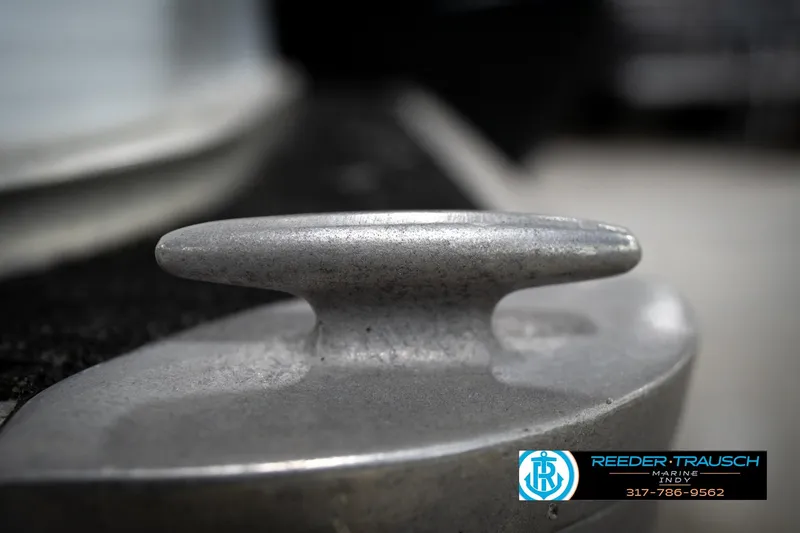 Slide: The Image of Close-up of a metal cleat on a 1993 Godfrey Sweetwater boat. - 50