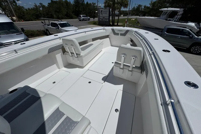 Slide: The Image of 2021 Invincible 36 Open Fisherman boat interior with seating and storage compartments. - 20