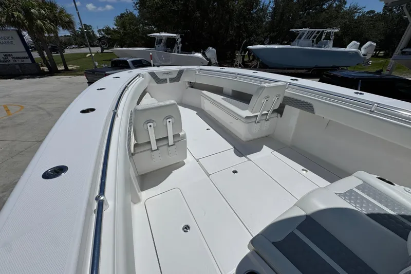 Slide: The Image of 2021 Invincible 36 Open Fisherman boat interior with seating and spacious deck. - 22