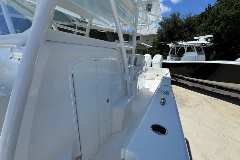 Slide: The Image of 2021 Invincible 36 Open Fisherman boat, sleek design, docked outdoors. - 27