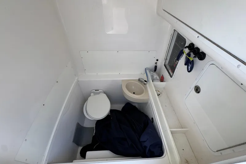 Slide: The Image of 2021 Invincible 36 Open Fisherman boat interior with toilet and sink. - 29
