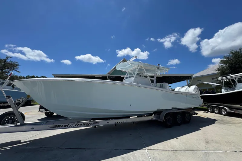 Slide: The Image of 2021 Invincible 36 Open Fisherman boat on trailer under clear blue sky. - 3