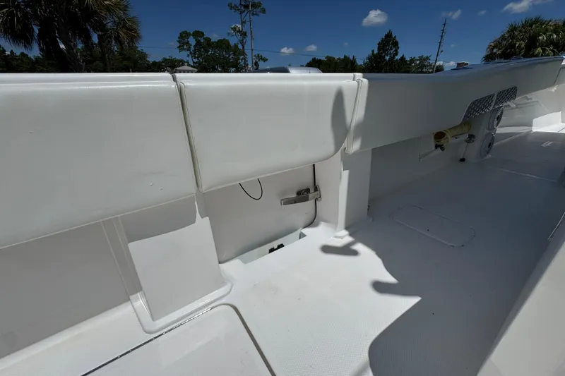 Slide: The Image of 2021 Invincible 36 Open Fisherman boat interior with white seating and storage compartments. - 39