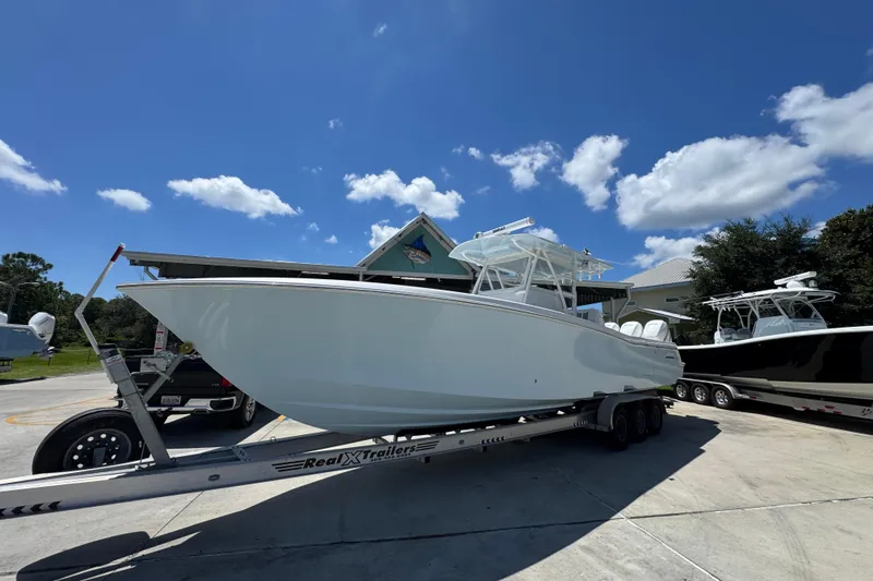 Slide: The Image of 2021 Invincible 36 Open Fisherman boat on trailer under clear blue sky. - 4