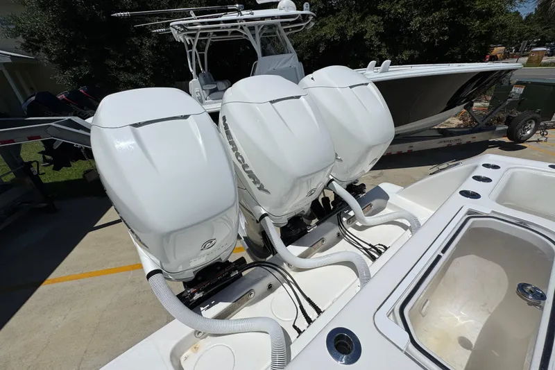 Slide: The Image of 2021 Invincible 36 Open Fisherman with triple Mercury outboard engines. - 43