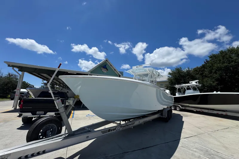 Slide: The Image of 2021 Invincible 36 Open Fisherman boat on trailer under clear blue sky. - 5
