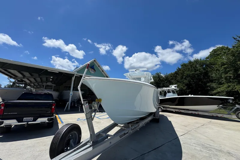 Slide: The Image of 2021 Invincible 36 Open Fisherman boat on trailer under clear blue sky. - 6
