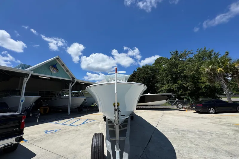 Slide: The Image of 2021 Invincible 36 Open Fisherman boat on trailer under clear blue sky. - 7