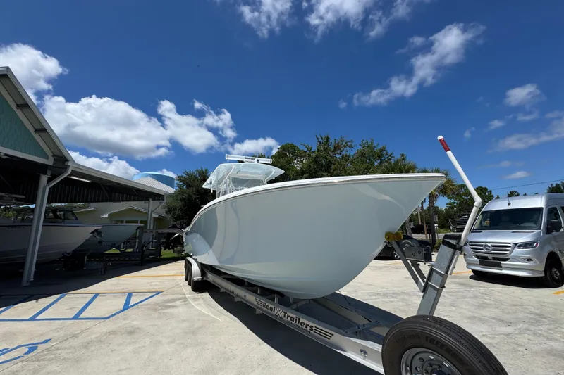 Slide: The Image of 2021 Invincible 36 Open Fisherman boat on trailer under clear blue sky. - 8