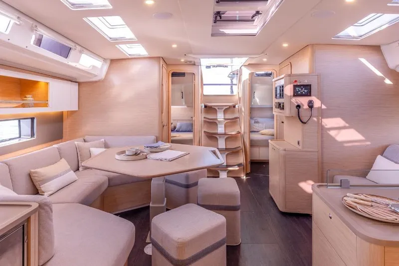 Slide: The Image of Luxurious interior of 2026 Dufour 48 yacht with modern furnishings and ample natural light. - 30