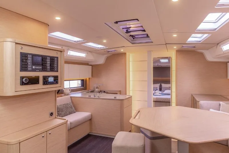 Slide: The Image of Luxurious interior of 2026 Dufour 48 yacht with modern design and ample natural light. - 39