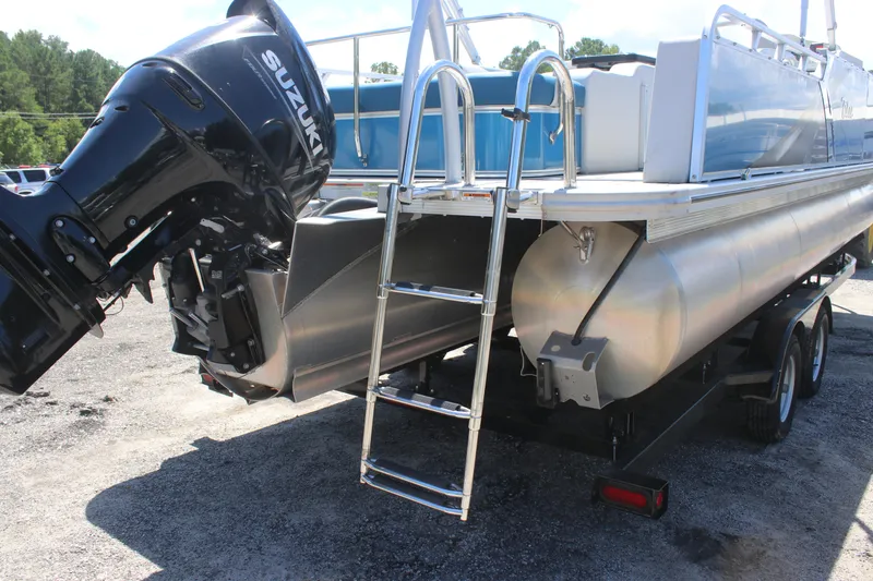 Slide: The Image of 2021 Tahoe Pontoon LTZ Versatile Rear Bench 24' with Suzuki outboard motor and ladder. - 7