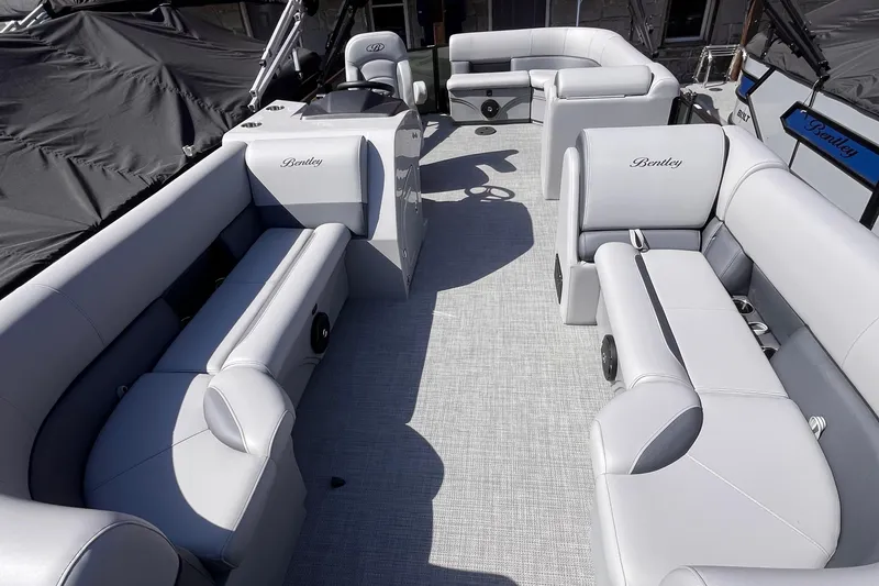 Slide: The Image of 2025 Bentley Pontoons Legacy Cruise XL with luxurious seating and modern design. - 2