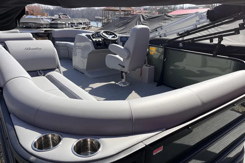 Slide: The Image of 2025 Bentley Pontoons Legacy Cruise XL interior with luxurious seating and modern helm. - 4