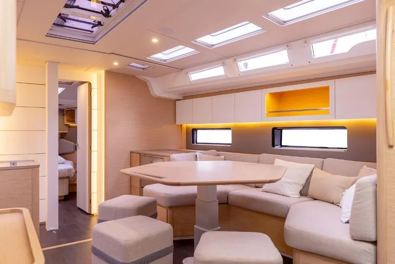 Slide: The Image of Woman reading in luxurious cabin of 2026 Dufour 48 yacht. - 36