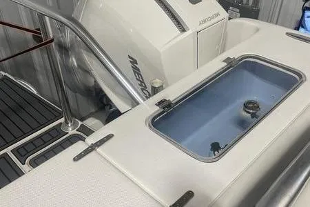 Slide: The Image of Luxury seating on 2022 Prowler 31 boat, featuring plush white cushions and armrests. - 10