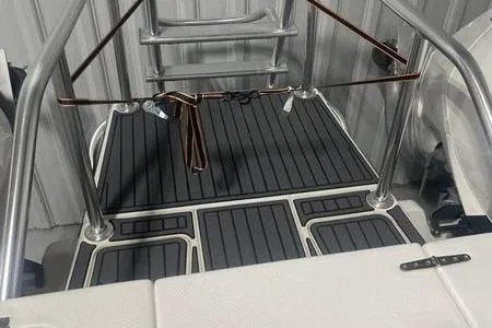 Slide: The Image of 2022 Prowler 31 boat interior with stainless steel seating and cup holders. - 11