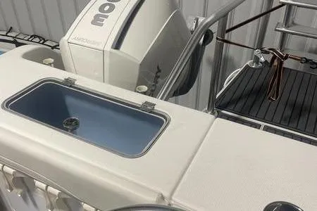 Slide: The Image of 2022 Prowler 31 boat interior with seating and stainless steel frame. - 12